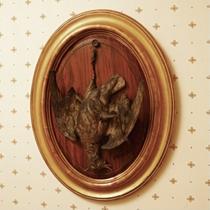 A PAIR OF CONTINENTAL GILT AND PATINATED BRONZE RELIEF GAME FIGURES