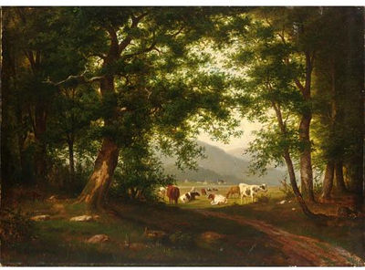 COWS AT PASTURE IN A MOUNTAINOUS LANDSCAPE
