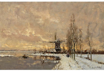 WINDMILLS IN A SNOW COVERED LANDSCAPE