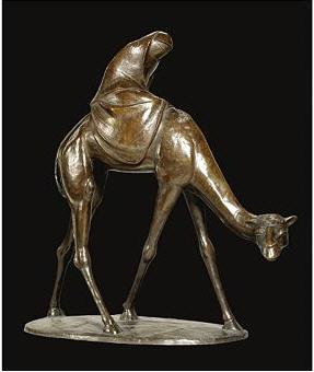 A veiled Arabian woman on a camel