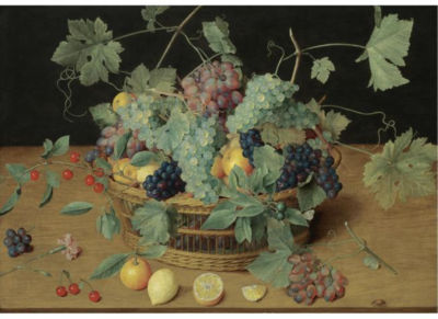 A STILL LIFE WITH FRUIT IN A BASKET, INCLUDING BUNCHES OF GRAPES AND LEMONS, CHERRIES AND ORANGES ON THE WOODEN TABLE BENEATH