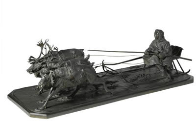 A BRONZE GROUP OF A TRAVELLER ON REINDEER-DRAWN SLEIGH
