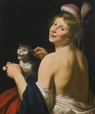 A YOUNG WOMAN PLAYING WITH A CAT