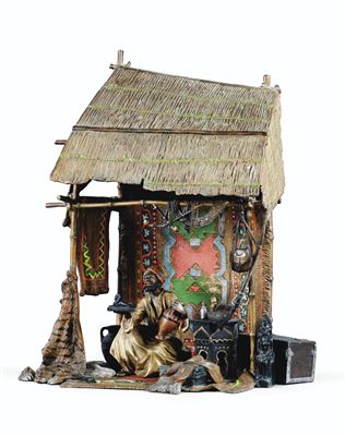 MARCHAND D'OBJETS D'ART DANS SA BOUTIQUE