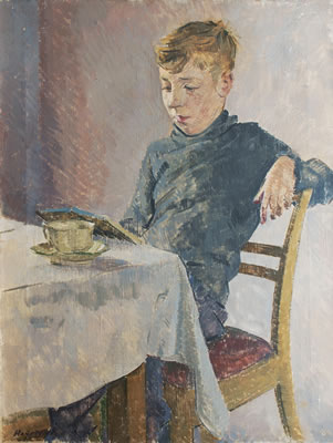Boy reading at a Table