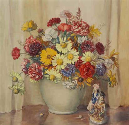 Still life of a vase of flowers beside a Staffordshire figure