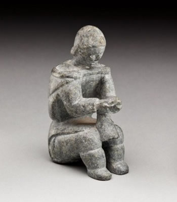 Woman softening a boot by Evie Qamugaaluk - Auction record, sale price, and art valuation. Compare with similar artists and explore comparable artworks.