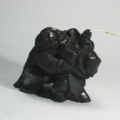 A FIGURE HOLDING ANOTHER