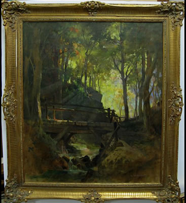 WOODEN FOOT BRIDGE OVER FOREST STREAM