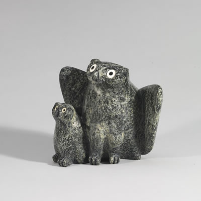 TWO PERCHED OWLS