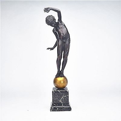BOY BALANCING ON A BALL