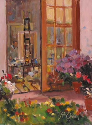 INTERIOR OF STUDIO WITH ARTIST AT WORK