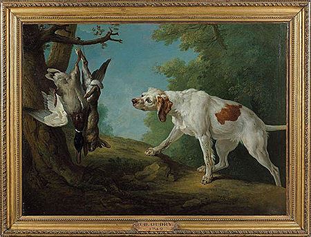 Chienne blanche à l'arrêt devant un lapin et un colver: