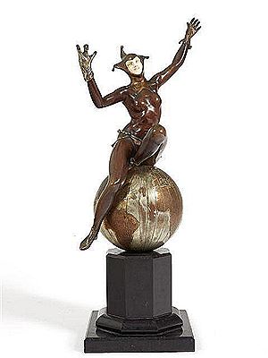 BOUFFON PERCHÉ SUR UN GLOBE