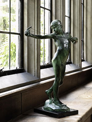 An extremely rare large green patinated bronze figure of 'The Slingshot' or 'Sling Boy' together with a plaster maquette of the same model