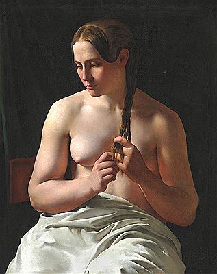 The model Catrine Nielsen, called Trine, is plaiting her hair.