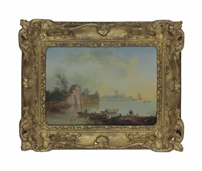 A moonlit river landscape with fishermen drawing in their nets and figures at a campfire