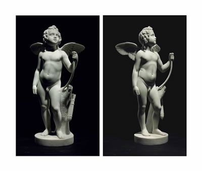 A MARBLE FIGURE OF CUPID WITH HIS BOW