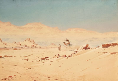 A camel rider in the desert