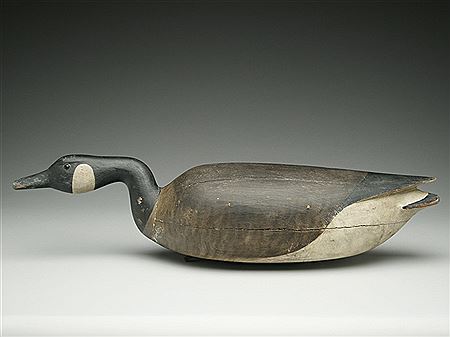 Hollow carved swimming Canada goose