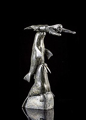 A serpentine carving of a Sedna, Whale and Walrus by Isaaci Etidlui - Auction record, sale price, and art valuation. Compare with similar artists and explore comparable artworks.