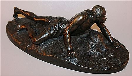GOOD CAST BRONZE OF A BLACK MAN carrying a knife