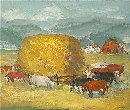 Cattle feeding next to haystack