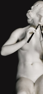 YOUNG WOMAN PLAYING PIPES