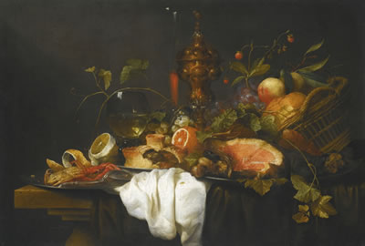 A 'PRONK' STILL LIFE OF FRUITS IN A BASKET TOGETHER WITH A GILT GOBLET, WINE GLASS, A HAM, A PIE, ORANGE, LEMON AND A CRAB, ALL UPON A TABLE DRAPED WITH BLUE AND WHITE CLOTHS