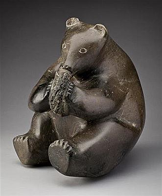 Seated Bear Cub Eating