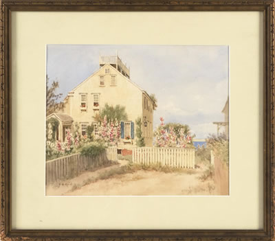 Nantucket house with roses and picket fence.