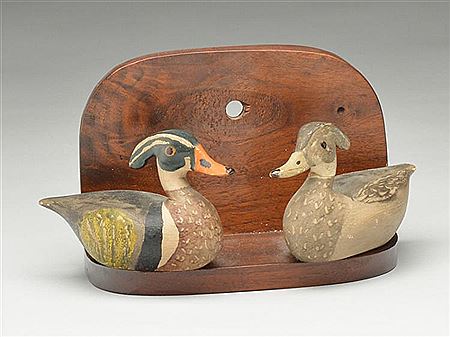 Wonderfully carved pair of miniature wood ducks