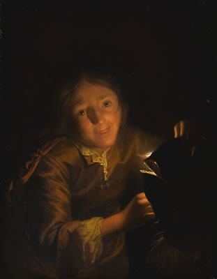 BOY HOLDING A CANDLE, PERHAPS TO ILLUMINATE A HALLOWEEN MASK